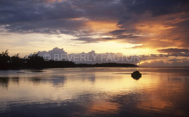 Island Sunsets;moorea;french polynesia;Island;sunset;sky;clouds;yellow;pink;sillouettes;colorful;reflection;ocean